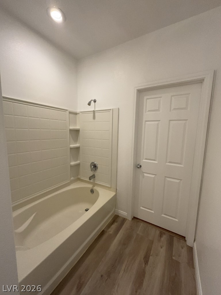 4915 East Russell Road, Unit 144 Las Vegas, NV 89120 - Photo 11 of 14 Full bathroom featuring dark wood finished floors and shower / tub combination