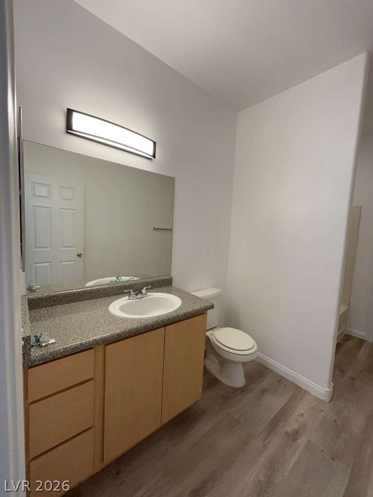 4915 East Russell Road, Unit 144 Las Vegas, NV 89120 - Photo 13 of 14 Bathroom with vanity and light wood-type flooring