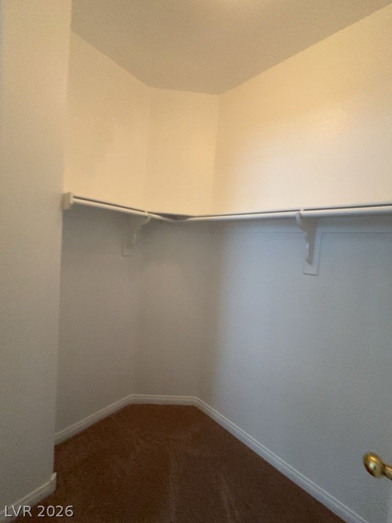 4915 East Russell Road, Unit 144 Las Vegas, NV 89120 - Photo 8 of 14 Walk in closet featuring dark colored carpet