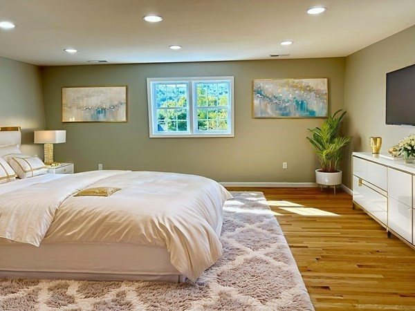 1 Heritage Lane Monson, MA 01057 - Photo 11 of 23 a bedroom with a large bed and a flat screen tv