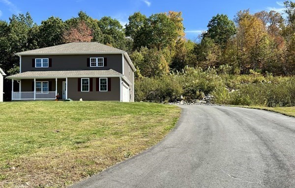 1 Heritage Lane Monson, MA 01057 - Photo 21 of 23 a front view of a house with a yard