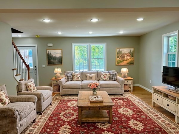 1 Heritage Lane Monson, MA 01057 - Photo 9 of 23 a living room with furniture a flat screen tv and a window