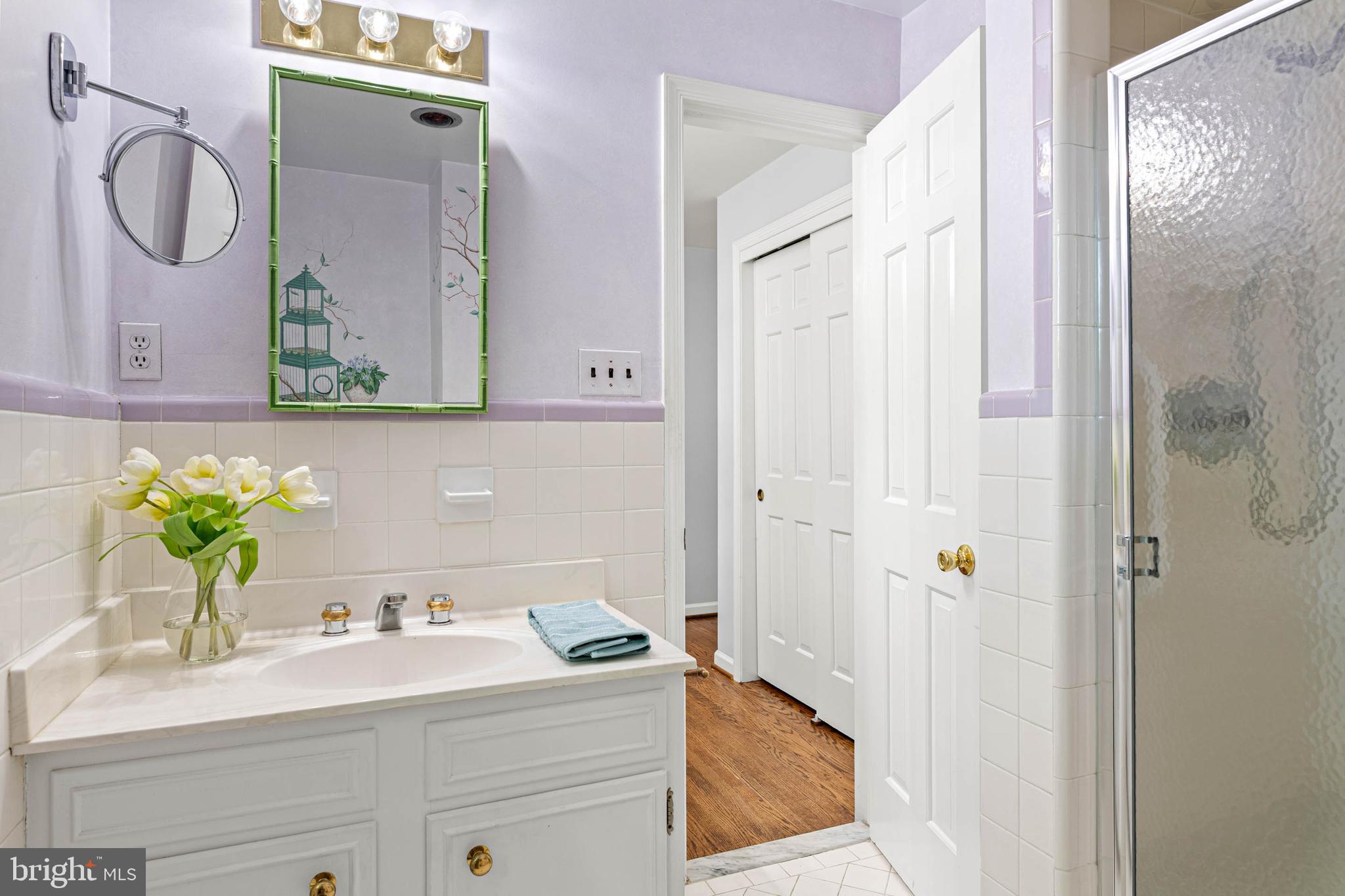 533 Gulph Road Wayne, PA 19087 - Photo 31 of 43 a bathroom with a granite countertop sink a mirror and shower