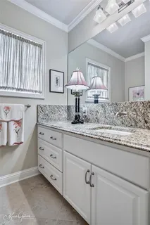 a kitchen with cabinets and window