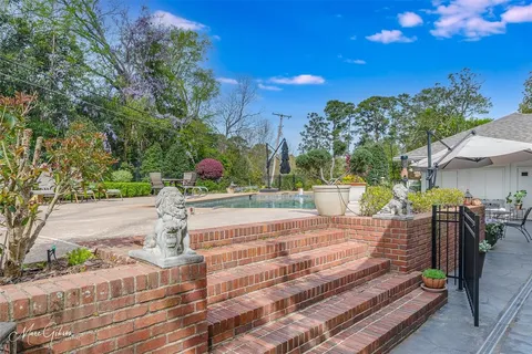 a view of a park with plants and a bench