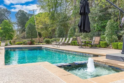 a view of a swimming pool with a patio