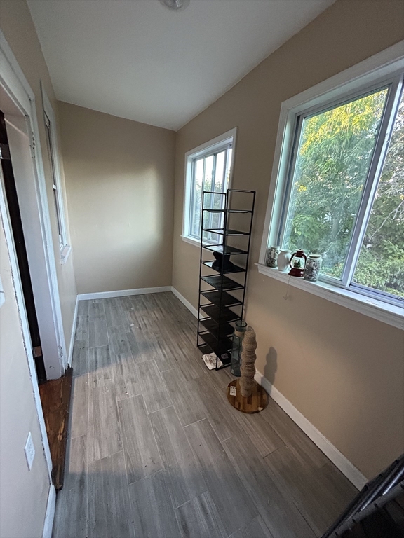 36 Hosmer Street, Unit 2 Boston, MA 02126 - Photo 18 of 30 wooden floor in an empty room with a window
