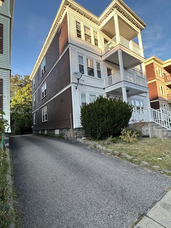 36 Hosmer Street, Unit 2 Boston, MA 02126 - Photo 2 of 30 a front view of a house with a yard