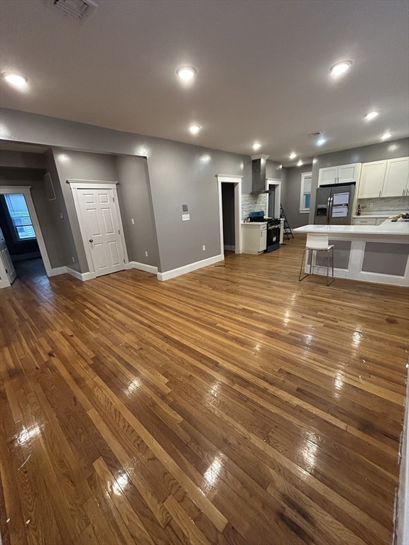 36 Hosmer Street, Unit 2 Boston, MA 02126 - Photo 21 of 30 a large room with yard