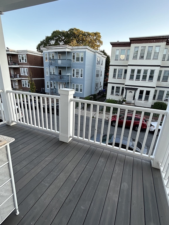 36 Hosmer Street, Unit 2 Boston, MA 02126 - Photo 24 of 30 a view of a balcony with wooden floor