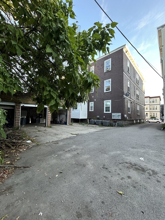 36 Hosmer Street, Unit 2 Boston, MA 02126 - Photo 27 of 30 a view of a street with a building in the background