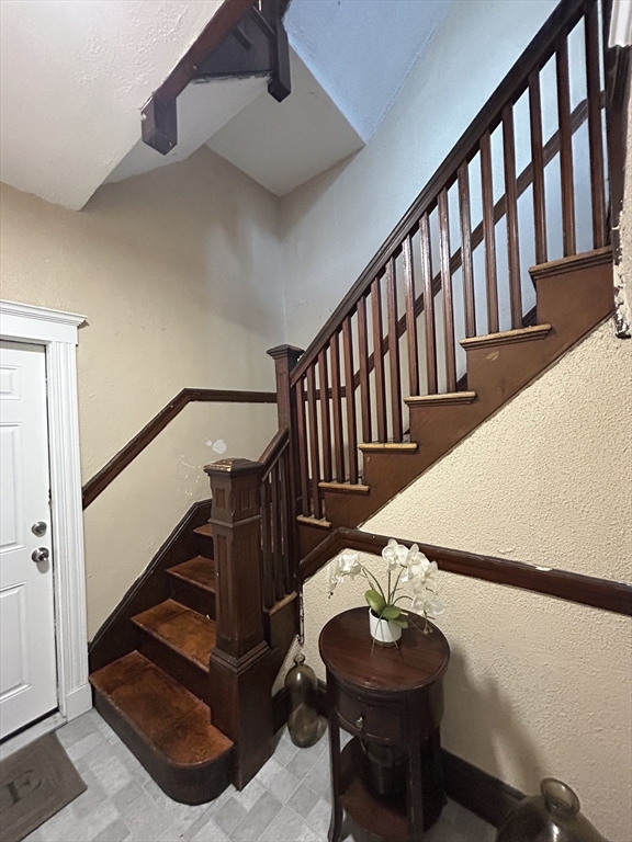 36 Hosmer Street, Unit 2 Boston, MA 02126 - Photo 6 of 30 a view of entryway with wooden floor and a chandelier