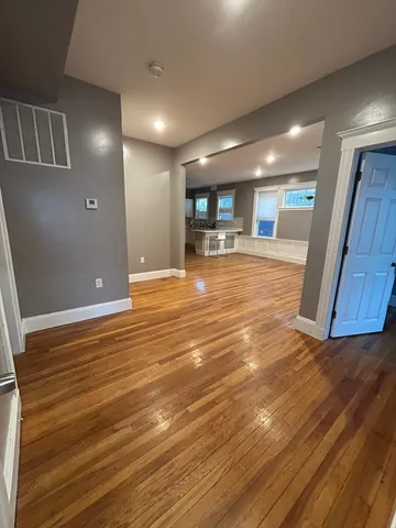 a view of a livingroom with furniture and wooden floor