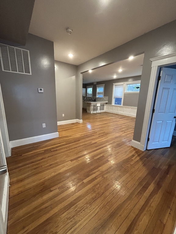 36 Hosmer Street, Unit 2 Boston, MA 02126 - Photo 8 of 30 a view of a livingroom with furniture and wooden floor
