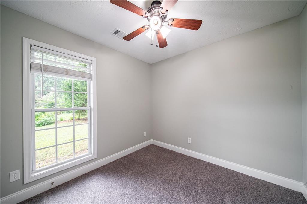 1927 Lee Road Salem, AL 36874 - Photo 39 of 45 Spare room with carpet and a ceiling fan