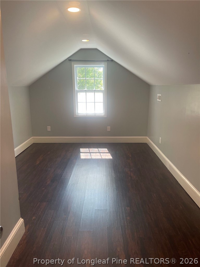 2515 Fort Bragg Road Fayetteville, NC 28303 - Photo 22 of 23 an empty room with wooden floor and windows