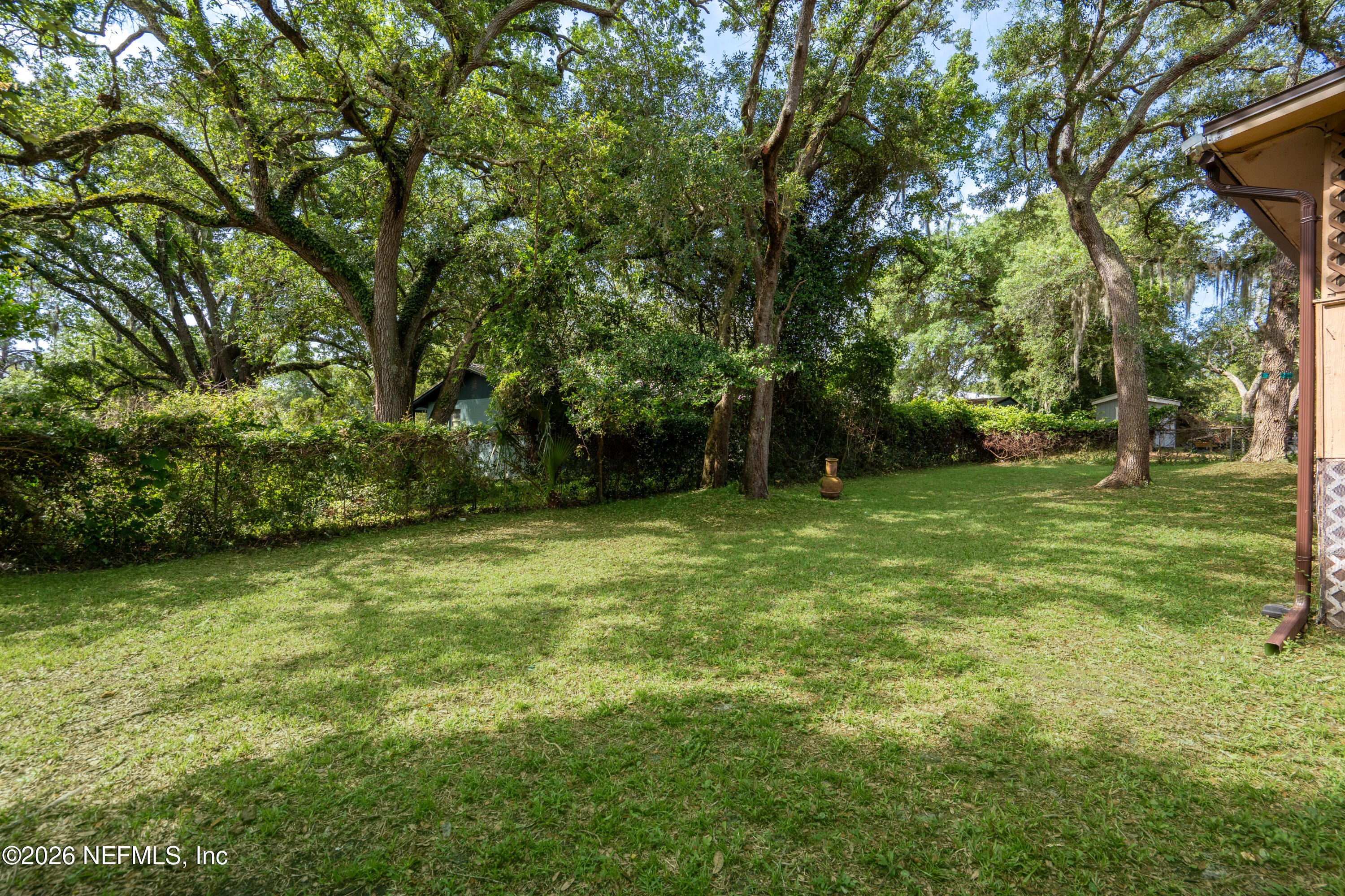 253 Cowry Road St. Augustine, FL 32086 - Photo 26 of 27 a view of outdoor space with deck and yard