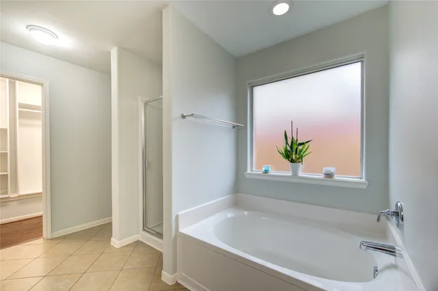 a white bath tub with a window