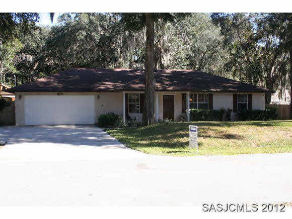 113 Linden Road St. Augustine, FL 32086 - Photo 1 of 19 a view of a house with a large tree in a yard