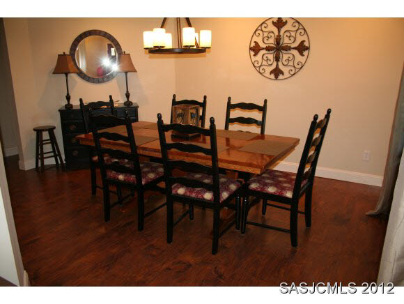113 Linden Road St. Augustine, FL 32086 - Photo 6 of 19 a view of a dining room with furniture and chandelier