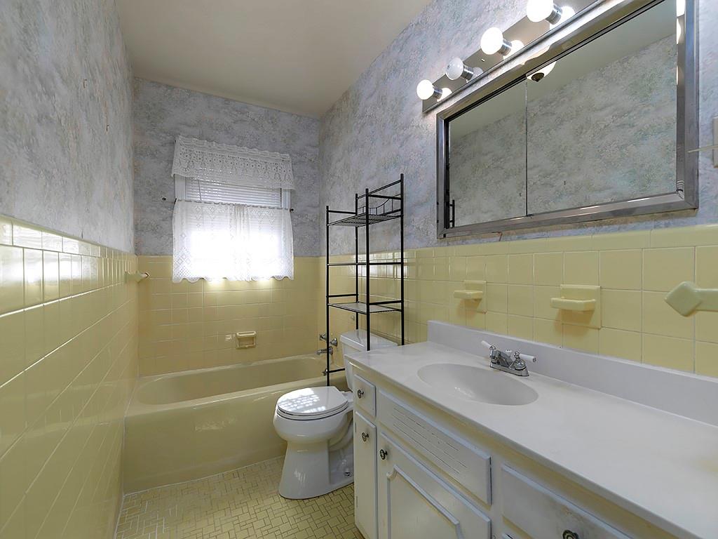 721 Woodvalley Road Southwest Mableton, GA 30126 - Photo 11 of 26 a bathroom with a sink a toilet and shower