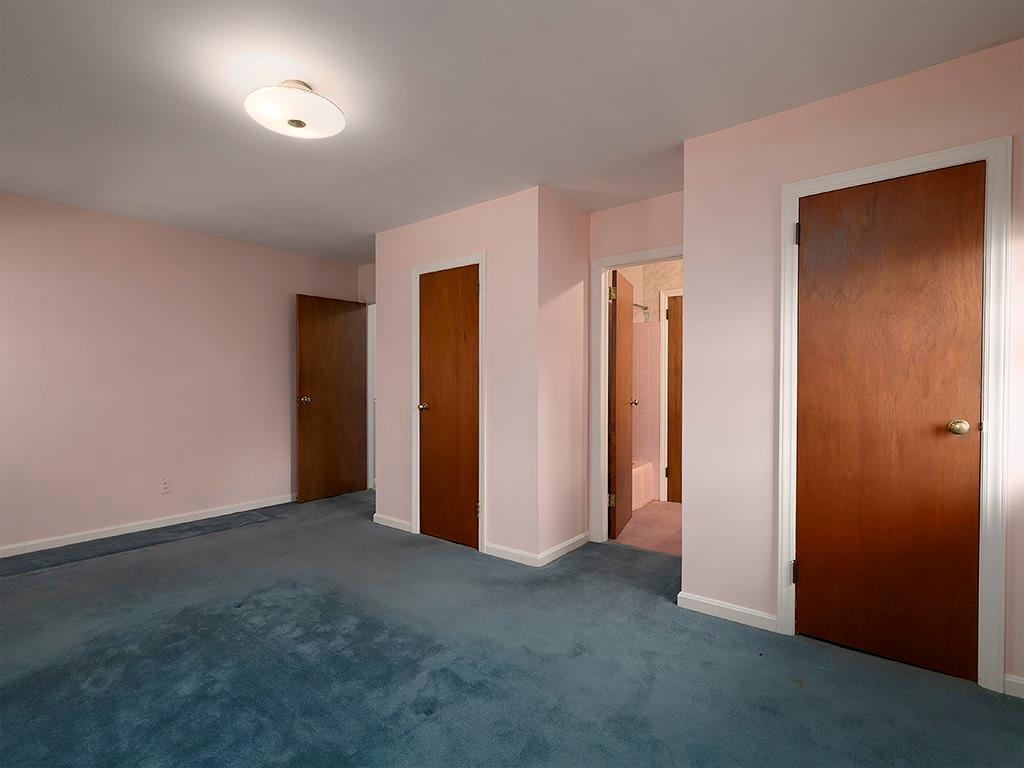 721 Woodvalley Road Southwest Mableton, GA 30126 - Photo 14 of 26 an empty room with closet and wooden floor