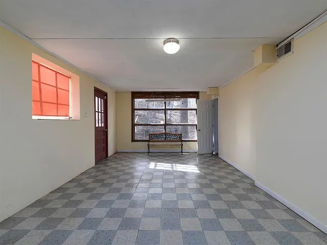 a view of a room with a window