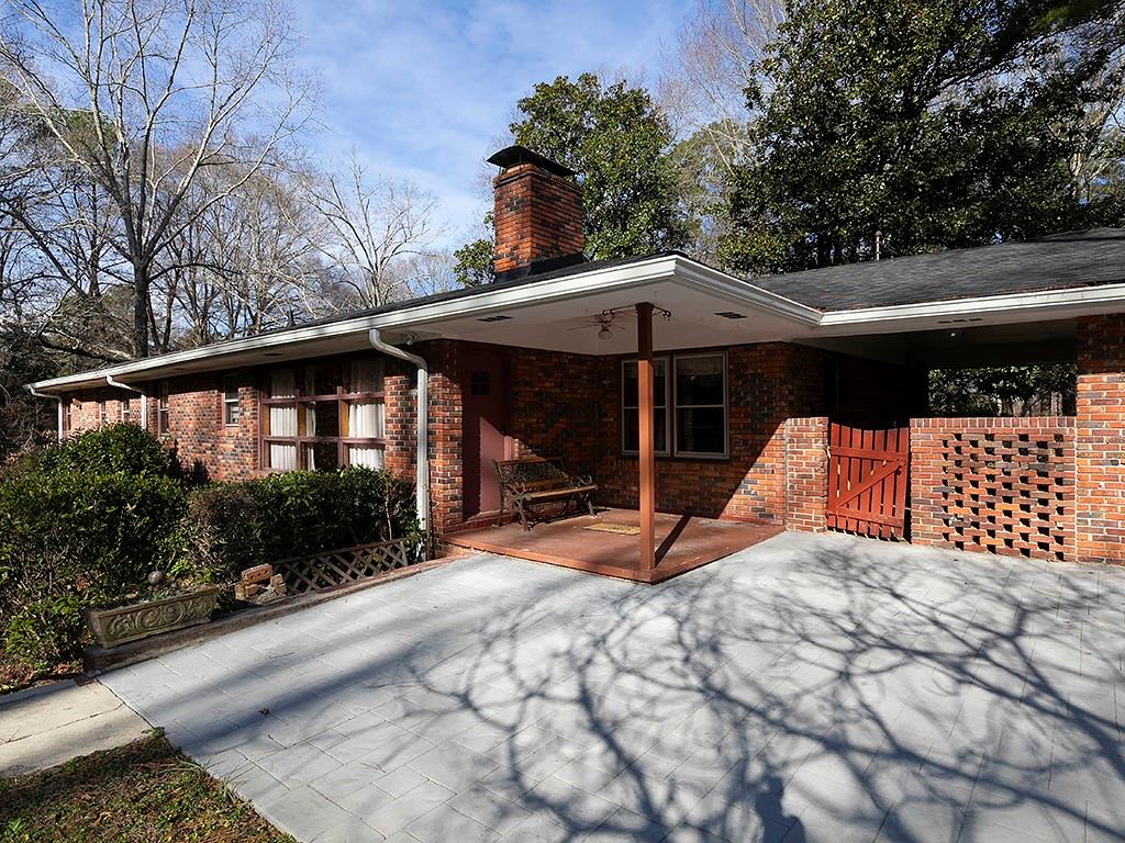 721 Woodvalley Road Southwest Mableton, GA 30126 - Photo 20 of 26 a view of a house with backyard and sitting area