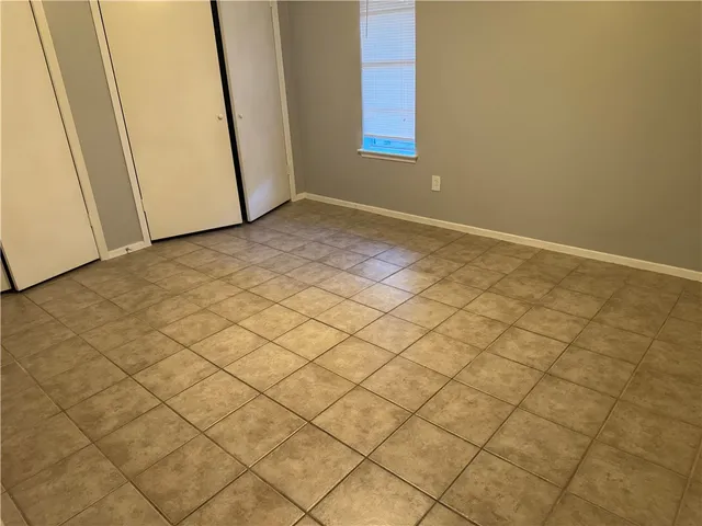 a view of an empty room and a window