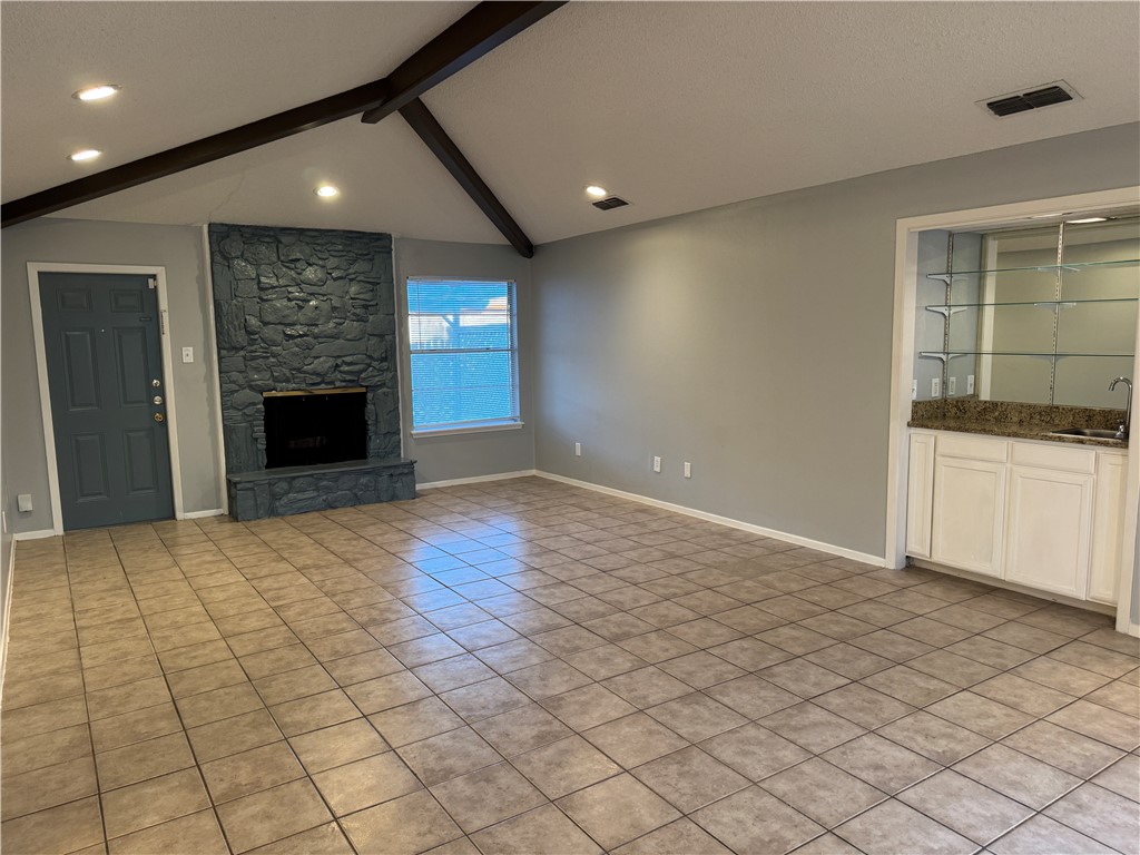 5518 Kenith Circle Corpus Christi, TX 78413 - Photo 5 of 21 an empty room with windows and fireplace