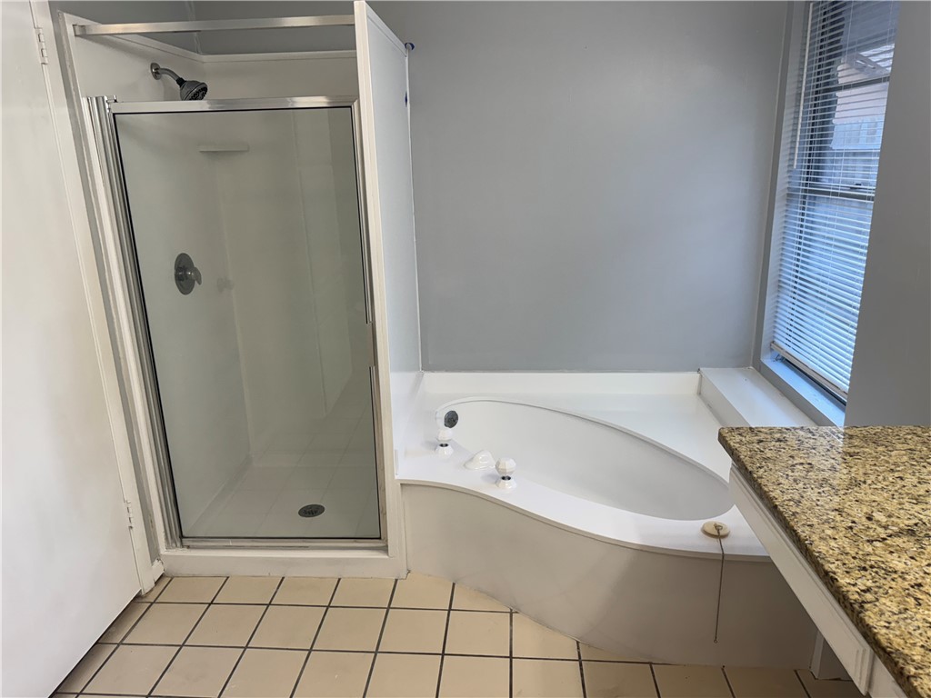 5518 Kenith Circle Corpus Christi, TX 78413 - Photo 9 of 21 a bathroom with a bathtub and shower