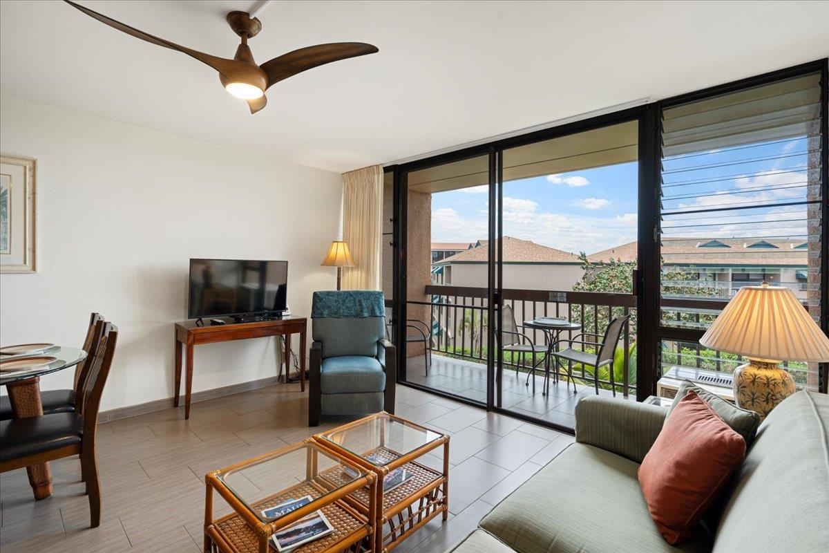 2191 South Kihei Road, Unit 2303 Kihei, HI 96753 - Photo 11 of 43 a living room with furniture and a flat screen tv