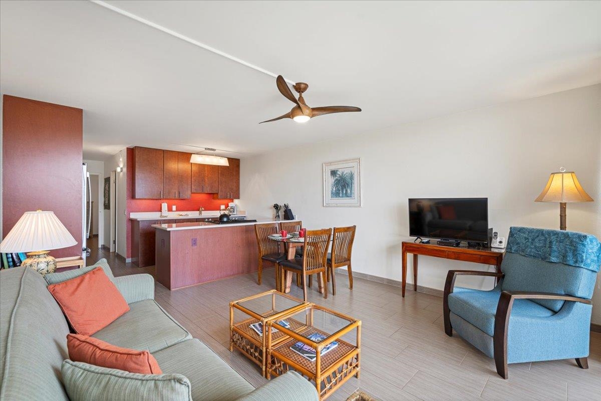 2191 South Kihei Road, Unit 2303 Kihei, HI 96753 - Photo 14 of 43 a living room with furniture kitchen view and a flat screen tv
