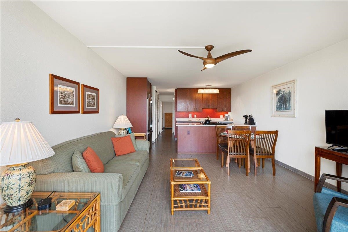 2191 South Kihei Road, Unit 2303 Kihei, HI 96753 - Photo 15 of 43 a living room with furniture a flat screen tv and a table
