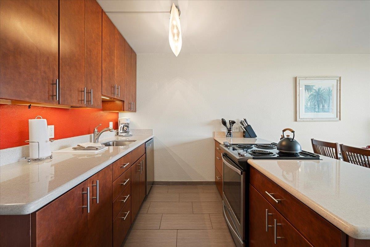 2191 South Kihei Road, Unit 2303 Kihei, HI 96753 - Photo 19 of 43 a kitchen with a sink and cabinets