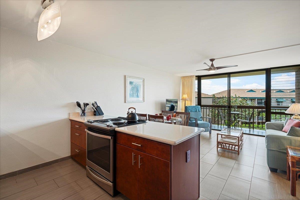 2191 South Kihei Road, Unit 2303 Kihei, HI 96753 - Photo 24 of 43 a kitchen with a sink and a stove