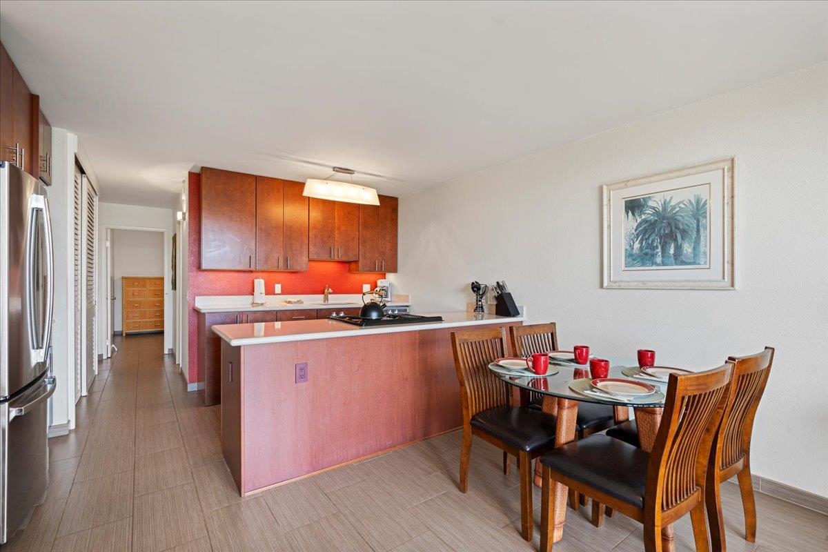 2191 South Kihei Road, Unit 2303 Kihei, HI 96753 - Photo 25 of 43 a dining room with furniture and wooden floor