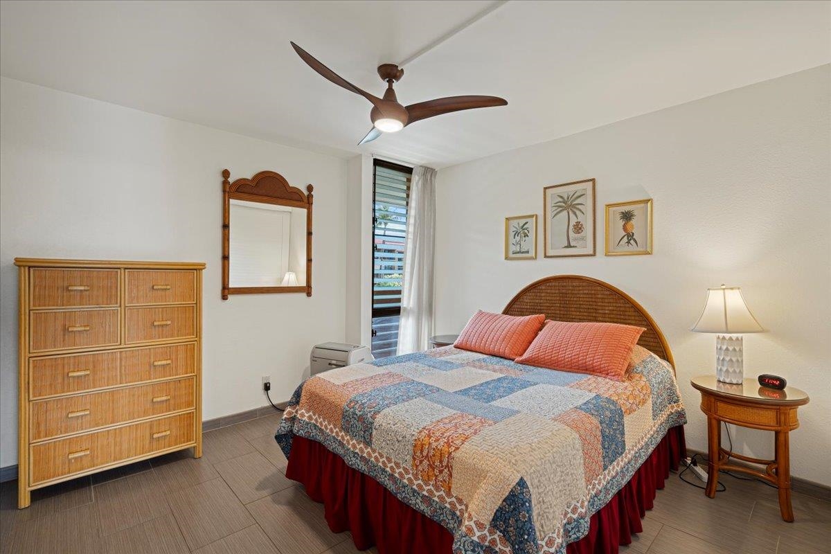 2191 South Kihei Road, Unit 2303 Kihei, HI 96753 - Photo 36 of 43 a bedroom with a bed and dresser