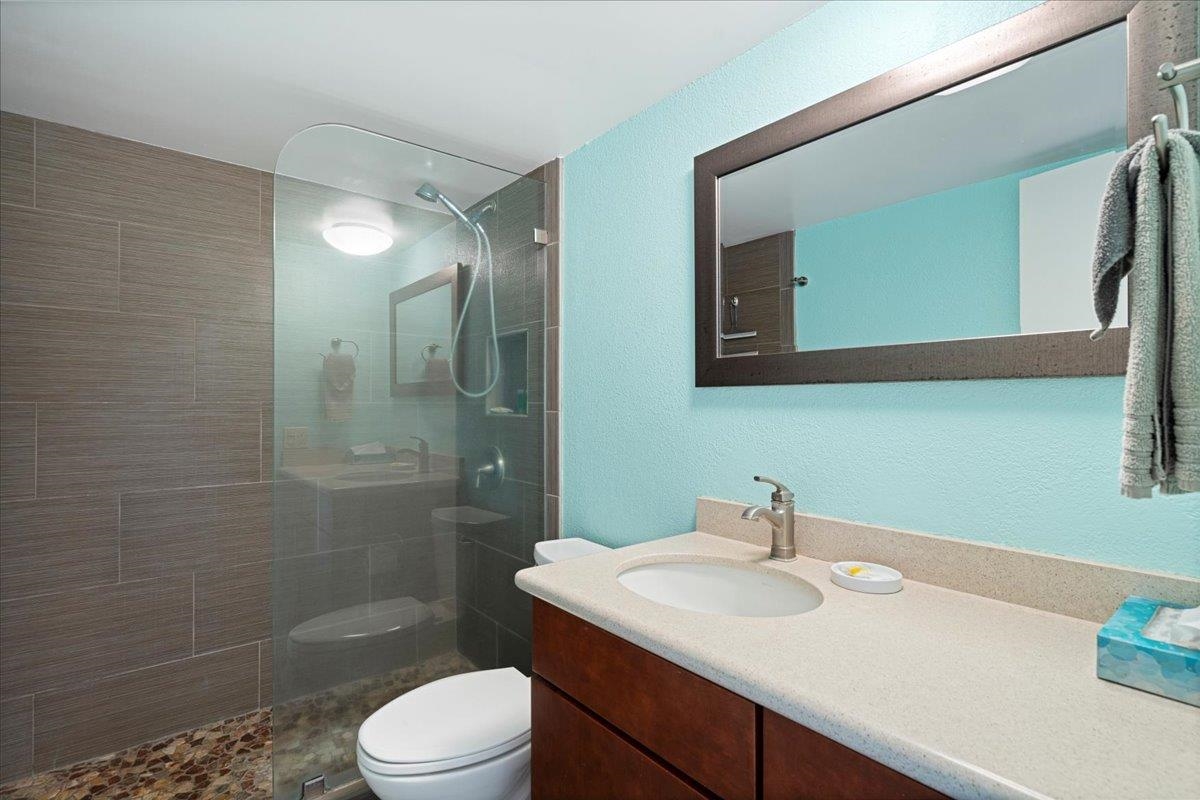 2191 South Kihei Road, Unit 2303 Kihei, HI 96753 - Photo 40 of 43 a bathroom with a sink a toilet and shower