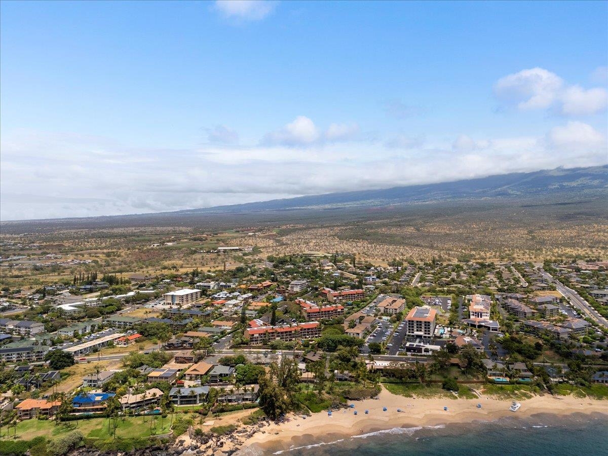 2191 South Kihei Road, Unit 2303 Kihei, HI 96753 - Photo 6 of 43 an aerial view of residential building and trees around