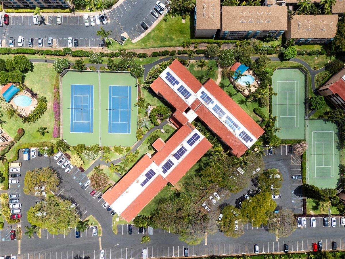 2191 South Kihei Road, Unit 2303 Kihei, HI 96753 - Photo 8 of 43 an aerial view of a house with a yard and outdoor seating