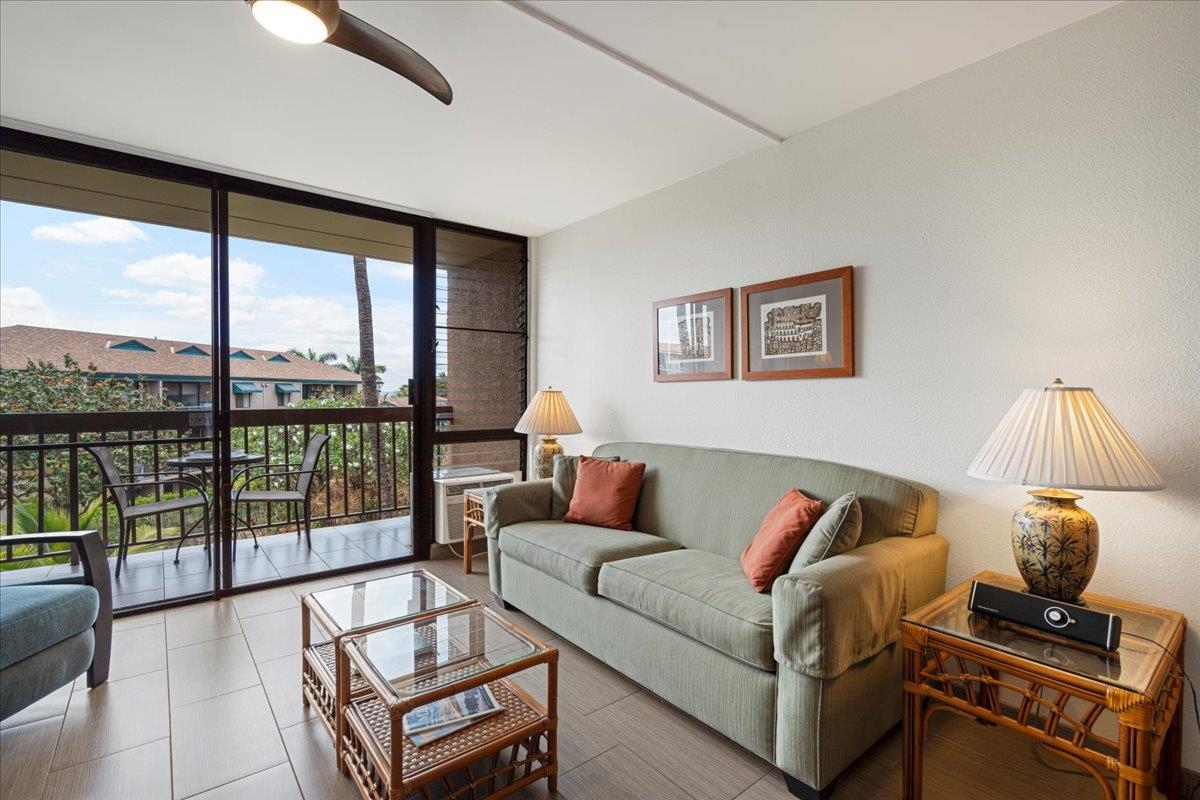 2191 South Kihei Road, Unit 2303 Kihei, HI 96753 - Photo 10 of 43 a living room with furniture and a large window