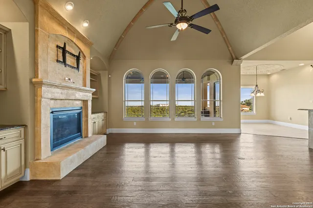 a view of a hallway with entryway wooden floor and dining room view