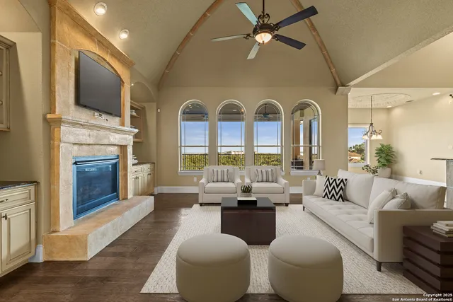 a kitchen with granite countertop a stove and white cabinets