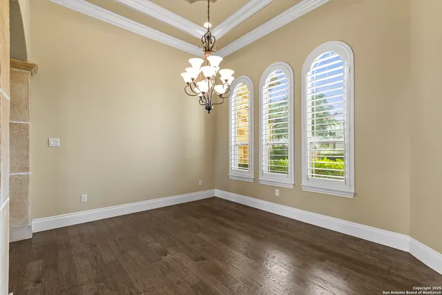 a view of a hallway with chandelier