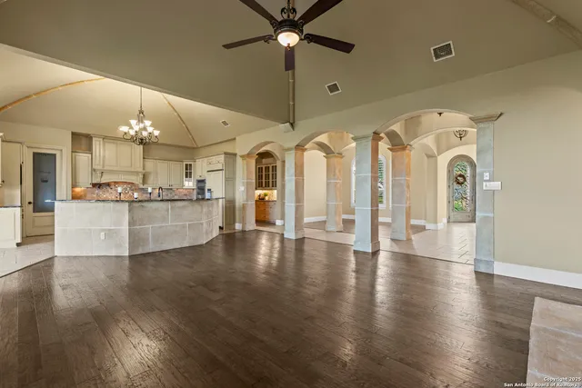 a kitchen with kitchen island granite countertop a table and chairs