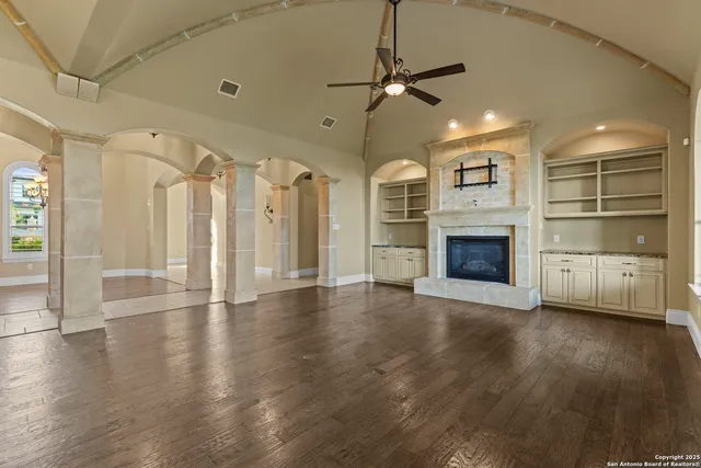 a view of an empty room with a fireplace