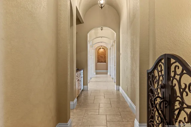 a spacious bathroom with a granite countertop sink mirror and shower