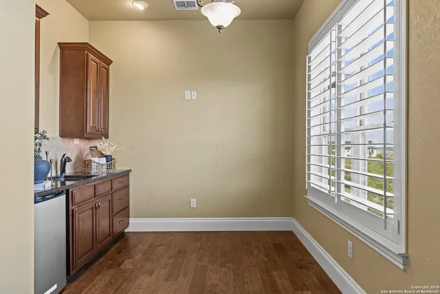an aerial view of multiple houses with yard