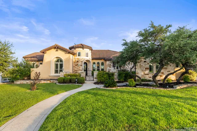 a wooden bench sitting in front of a building